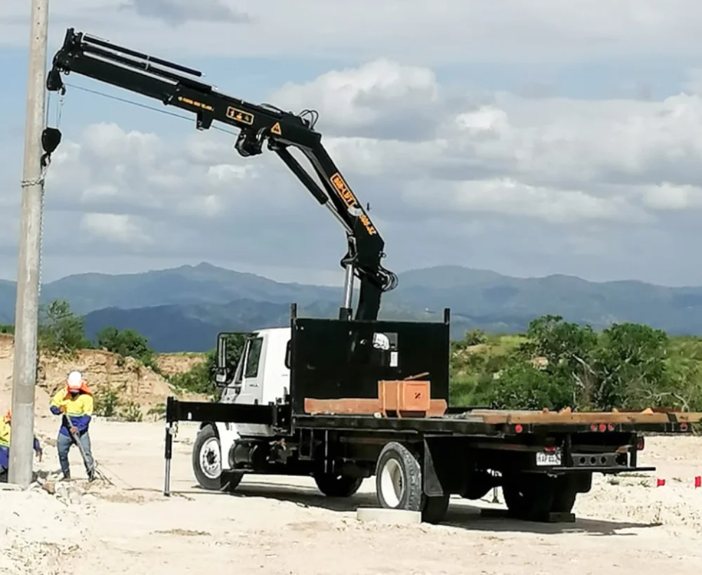 Placing infrastructure and utility materials with a crane truck in Asheville and Western North Carolina