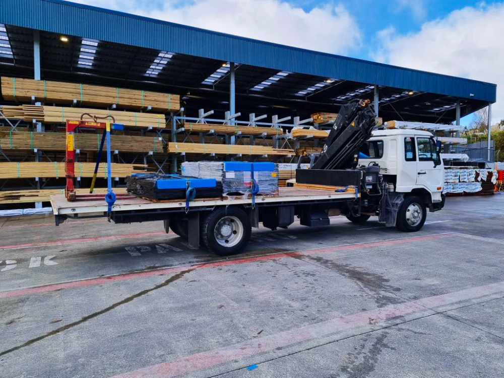 Asheville same day construction supply delivery with crane truck by Up! Up! Lifting