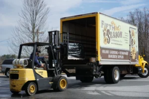 Loading heavy cargo on a box truck with a forklift