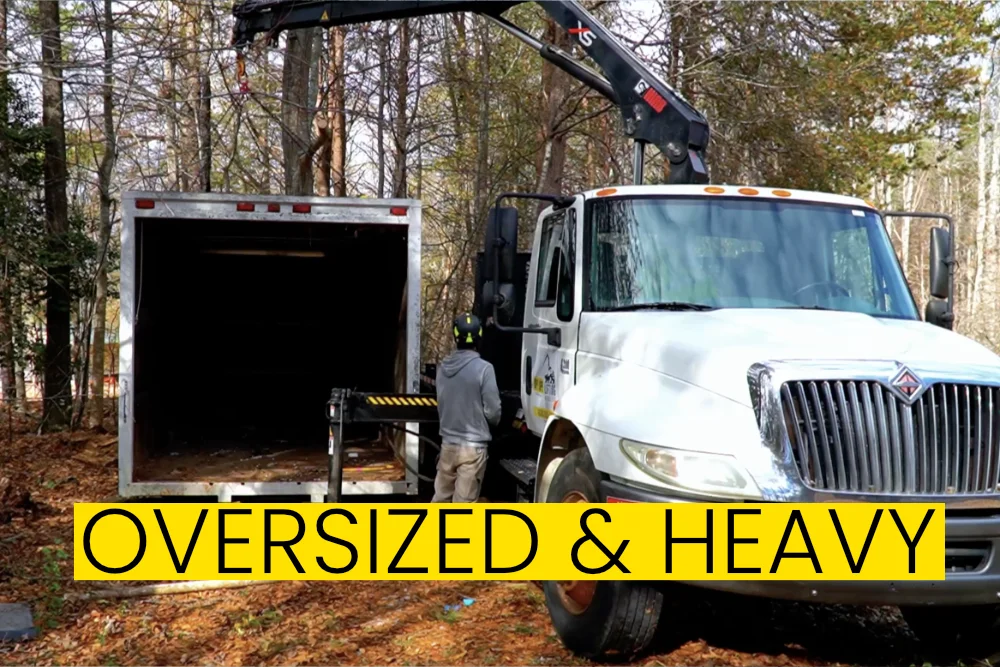 removing oversized heavy items with crane truck in Asheville