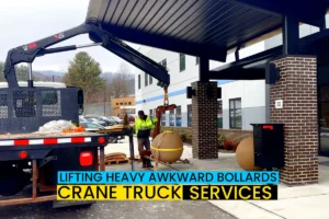 crane truck lifting and placing bollards heavy awkward cargo for commerical customer