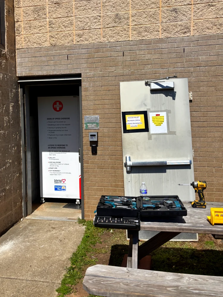 Up! Up! Lifting crane truck service in North Carolina installing vending machine for client