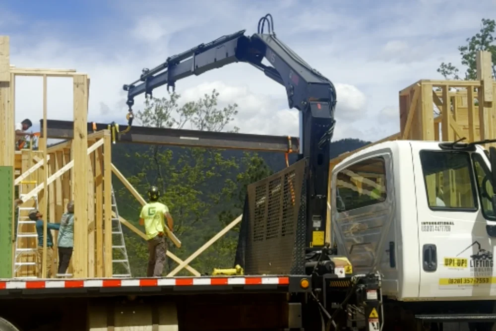 teel ceiling beam being slid into final position along a temporary stub wall
